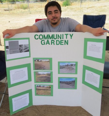 Las Cruces high school student presenting his regenerative agriculture project at Legacy Farm